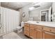 Basement bathroom with a shower/tub combo, double vanity, and ample storage at 6020 Cherokee Trce, Cumming, GA 30041