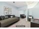 Virtually staged bedroom with daybed, mirrored closet, and workspace at 44 Peachtree Nw Pl # 834, Atlanta, GA 30309