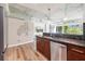 Modern kitchen with stainless steel appliances and wood cabinets at 44 Peachtree Nw Pl # 834, Atlanta, GA 30309