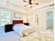 Spacious bedroom with ceiling fan, walk-in closet, and neutral decor at 430 Thornbush Trce, Lawrenceville, GA 30046