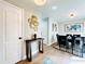 Elegant dining room featuring a dark wood table, six black chairs, and modern wall art at 430 Thornbush Trce, Lawrenceville, GA 30046
