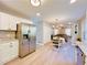 Modern kitchen with stainless steel appliances and light hardwood floors at 430 Thornbush Trce, Lawrenceville, GA 30046