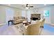 Living room features a stone fireplace, hardwood floors, and neutral-toned furniture at 430 Thornbush Trce, Lawrenceville, GA 30046