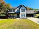 Two-story home with white siding, black accents, and a well-manicured lawn at 430 Thornbush Trce, Lawrenceville, GA 30046