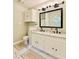 Double vanity bathroom with granite countertops and updated fixtures at 430 Thornbush Trce, Lawrenceville, GA 30046