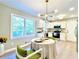 Bright kitchen with white cabinets, stainless steel appliances, and granite countertops at 430 Thornbush Trce, Lawrenceville, GA 30046