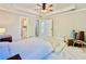 Large bedroom with ceiling fan and access to private bathroom at 430 Thornbush Trce, Lawrenceville, GA 30046