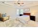 Bright bedroom with ceiling fan, hardwood floors, and neutral decor at 430 Thornbush Trce, Lawrenceville, GA 30046