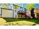 Two-story house with a deck, backyard, and mature landscaping at 430 Thornbush Trce, Lawrenceville, GA 30046