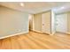 Finished basement with light wood flooring and ample storage space at 430 Thornbush Trce, Lawrenceville, GA 30046