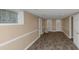 Finished basement with grey laminate flooring and neutral walls at 122 Austin Ne Ave, Marietta, GA 30060