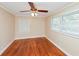 Spacious bedroom with hardwood floors and ceiling fan at 122 Austin Ne Ave, Marietta, GA 30060