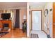 Bright entryway with hardwood floors, a fireplace, and an arched doorway at 3208 Edgemont Way, Decatur, GA 30032