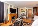 Living room with hardwood floors, a fireplace, and brown sofas at 3208 Edgemont Way, Decatur, GA 30032
