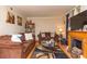 Living room with hardwood floors, a fireplace, and brown sofas at 3208 Edgemont Way, Decatur, GA 30032