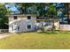 Brick ranch home with a well-manicured lawn and American flag at 3208 Edgemont Way, Decatur, GA 30032