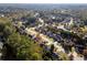 Aerial view of a residential neighborhood with houses and trees at 84 Hunters Xing, Dallas, GA 30157