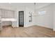 Dining room with hardwood floors, a chandelier, and access to the kitchen at 603 Brashy St, Woodstock, GA 30188