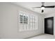Bedroom with carpet, ceiling fan, and large window at 603 Brashy St, Woodstock, GA 30188