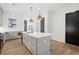 Modern kitchen with gray cabinets, white quartz countertops and island at 603 Brashy St, Woodstock, GA 30188
