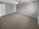 Spacious bedroom with plush carpet and ceiling fan at 3541 Old Chamblee Tucker Rd # G, Atlanta, GA 30340