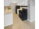 Efficient kitchen, white cabinets, black appliances at 3541 Old Chamblee Tucker Rd # G, Atlanta, GA 30340