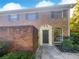 Brick townhouse with a dark brown door at 3541 Old Chamblee Tucker Rd # G, Atlanta, GA 30340