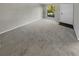 Spacious living room with neutral carpeting and large window at 3541 Old Chamblee Tucker Rd # G, Atlanta, GA 30340