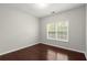 Spacious bedroom with hardwood floors and large window at 911 Queensbrooke Way, Mableton, GA 30126