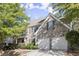 Two-story brick home with a two-car garage at 911 Queensbrooke Way, Mableton, GA 30126