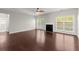 Spacious living room with hardwood floors and fireplace at 911 Queensbrooke Way, Mableton, GA 30126