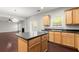 Bright kitchen with island, hardwood floors, and ample cabinetry at 911 Queensbrooke Way, Mableton, GA 30126