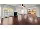 Open living room with hardwood floors and fireplace at 911 Queensbrooke Way, Mableton, GA 30126
