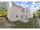House's backyard with a patio and grassy area at 911 Queensbrooke Way, Mableton, GA 30126