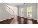 Bright living room with hardwood floors and large windows at 911 Queensbrooke Way, Mableton, GA 30126