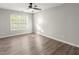 Well-lit bedroom with hardwood floors and ceiling fan at 911 Queensbrooke Way, Mableton, GA 30126