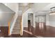 Two-story foyer with hardwood floors and a grand staircase at 911 Queensbrooke Way, Mableton, GA 30126