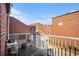 Private balcony with brick wall and metal railing, overlooks courtyard at 385 Ralph Mcgill Ne Blvd # D, Atlanta, GA 30312