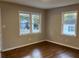 Spacious living area featuring hardwood floors, large windows, and neutral wall colors at 411 Greencove Se Ln, Atlanta, GA 30316