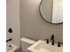 Modern bathroom with white vanity, black matte fixtures, and subway tile at 411 Greencove Se Ln, Atlanta, GA 30316