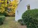 Rear view of house showcasing painted brick exterior and landscaping at 411 Greencove Se Ln, Atlanta, GA 30316
