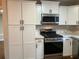 Updated kitchen boasts ample storage and stainless steel appliances at 411 Greencove Se Ln, Atlanta, GA 30316