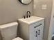 Simple bathroom with a white vanity and black matte fixtures at 411 Greencove Se Ln, Atlanta, GA 30316