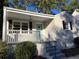 Updated brick ranch with a welcoming front porch, new paint, and attractive landscaping at 411 Greencove Se Ln, Atlanta, GA 30316
