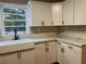 Newly renovated kitchen, featuring white shaker cabinets, quartz countertops, and stainless steel appliances at 411 Greencove Se Ln, Atlanta, GA 30316