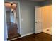 Spacious bedroom with hardwood floors and access to bathroom at 411 Greencove Se Ln, Atlanta, GA 30316