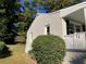 Side view of house showcasing painted brick exterior and landscaping at 411 Greencove Se Ln, Atlanta, GA 30316