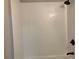 Clean white subway tiled shower with black matte fixtures at 411 Greencove Se Ln, Atlanta, GA 30316