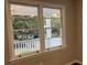 Window view of front porch and residential street at 411 Greencove Se Ln, Atlanta, GA 30316