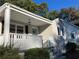 Renovated ranch house with a covered porch, new paint, and well-maintained landscaping at 411 Greencove Se Ln, Atlanta, GA 30316